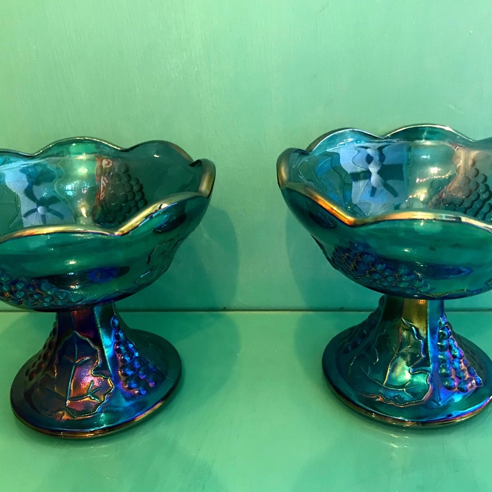 PAIR of blue Carnival Glass footed candle holders.